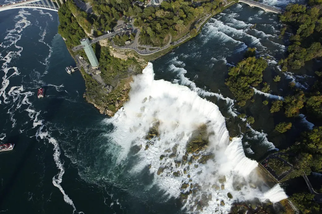 Aerial helicopter view of American Falls at Niagara Falls New York showing the spectacular waterfall from above
