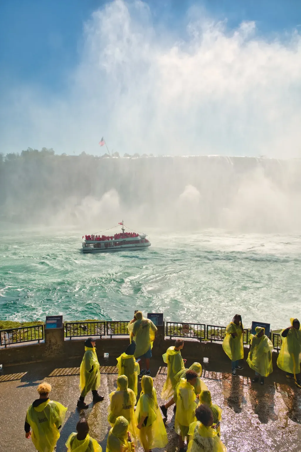Niagara City Cruises boat approaching Horseshoe Falls through the mist