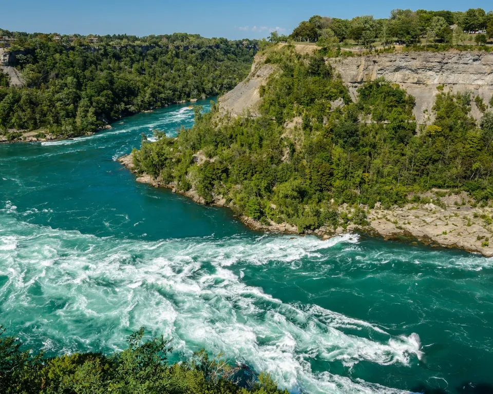 Dramatic view of the swirling Niagara Whirlpool along the river