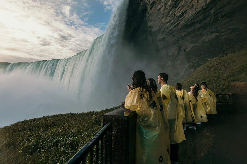 Tourists on lower observation deck viewing Horseshoe Falls up close